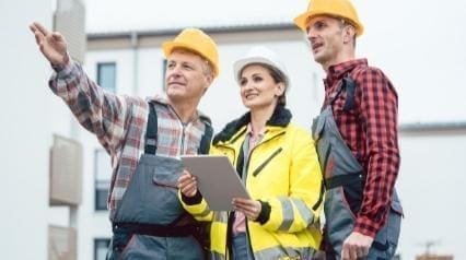 3 people wearing a safety helmet